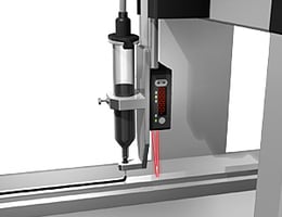 Controlling the height of a dispenser nozzle